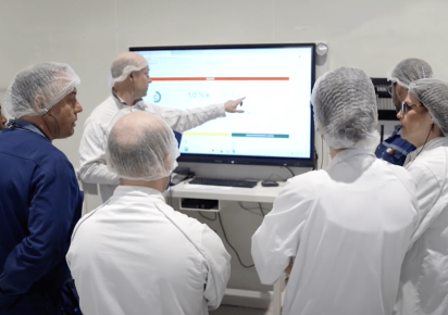 Manufacturers during huddle meeting or performance meeting using a digital SQDIP board.