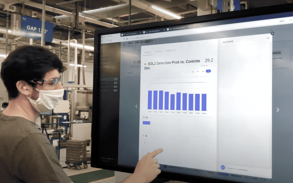 An engineer form Lisi Aerospace problem solving on the shop floor using fabriq, a digital daily management system.