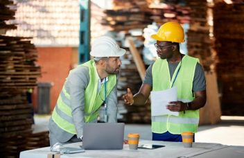 Manufacturers on the factory floor implementing a Continuous Improvement Model