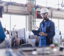 Manufacturer using digital Lean Six Sigma tools on the manufacturing shop floor to reduce waste and improve quality.