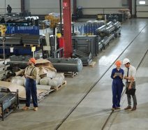 Hidden factory activities in manufacturing such as rework, inspections, and unplanned work on a factory floor. Image shows manufacturers on plant floor.