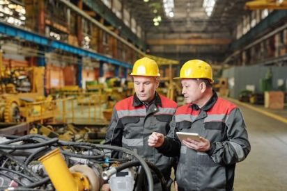 Manufacturers on shop floor utilizing the deming cycle to continuous improve.