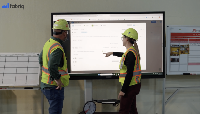 head of quality with employee using their top ranked shop floor management software.